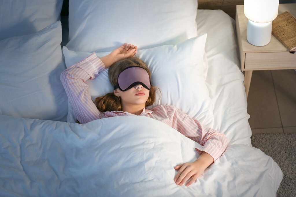 woman sleeping on bed