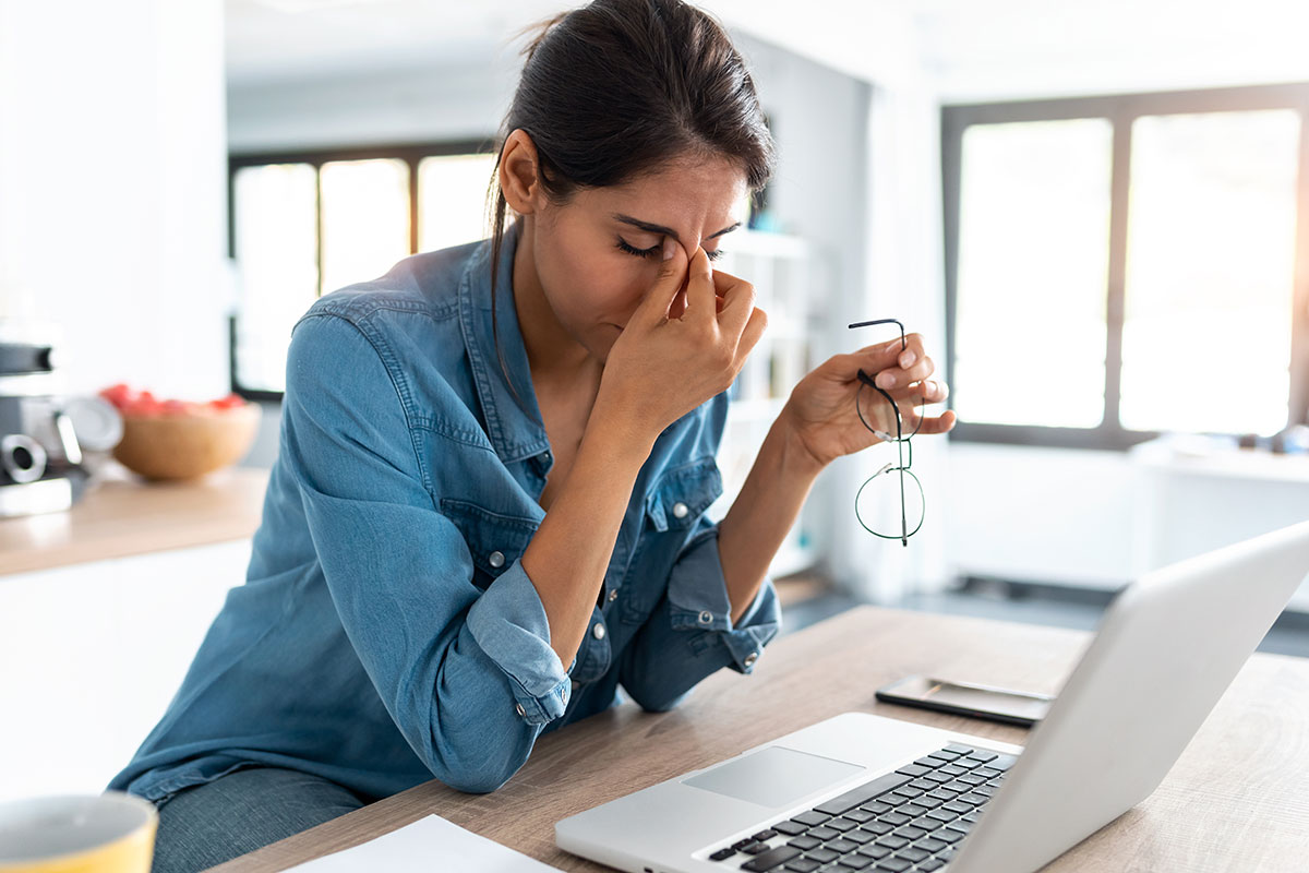 stressed woman working on laptop